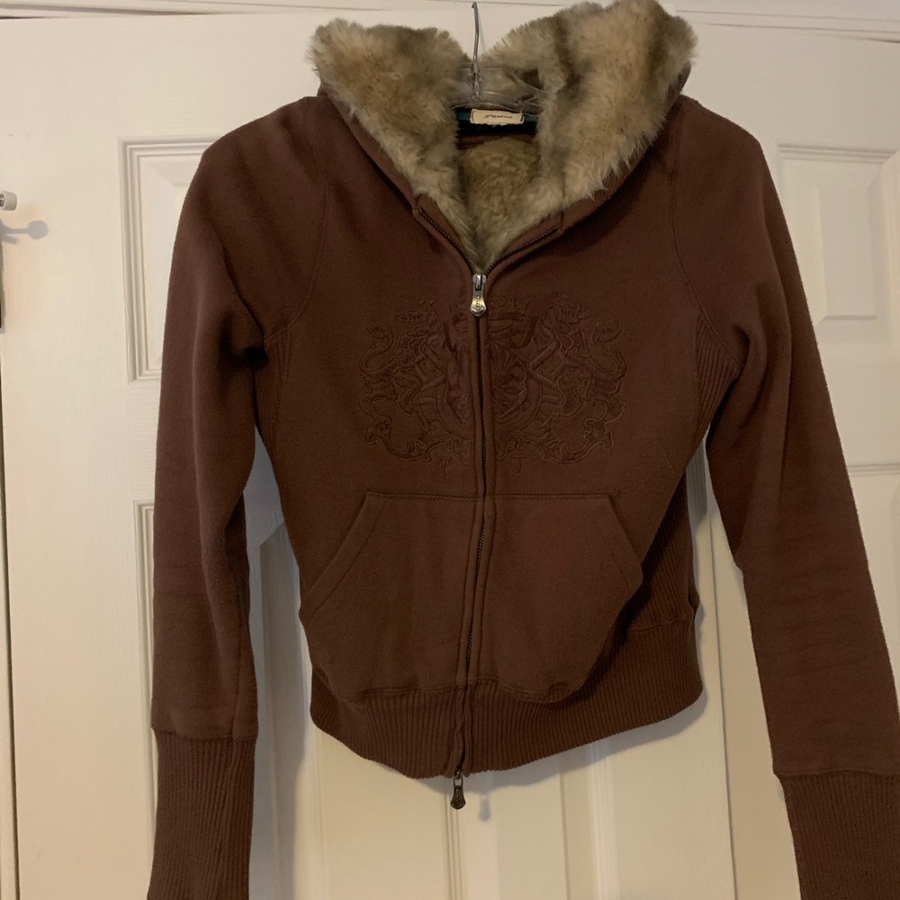 Hooded faux fur lined zip up jacket.